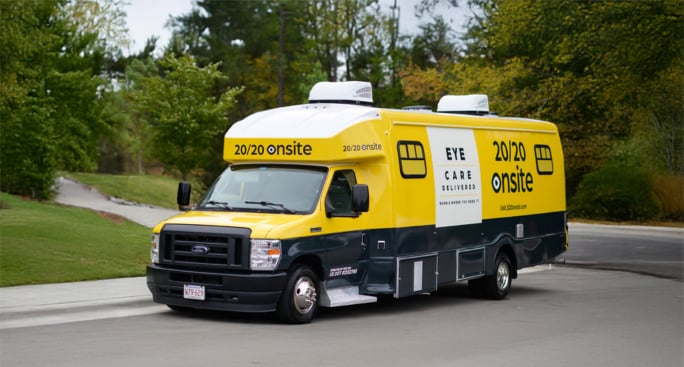 Yellow 20/20 Onsite Mobile Vision Clinic van providing point-of-need ophthalmic assessments