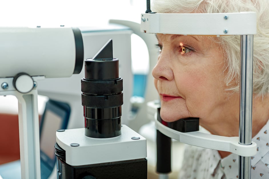 Older female patient eye examination.