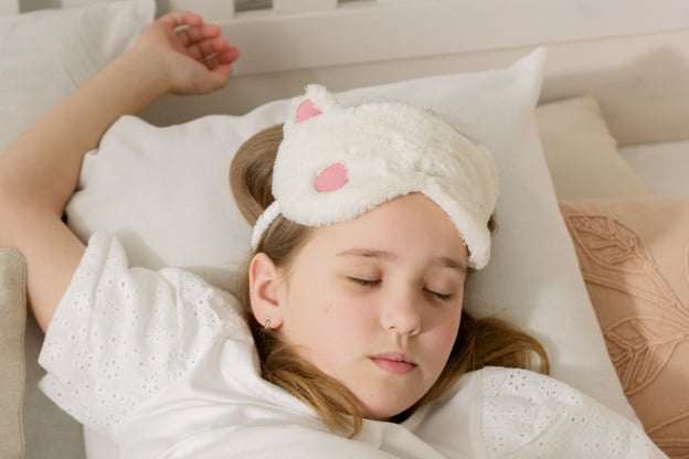 kid wearing sleep masking