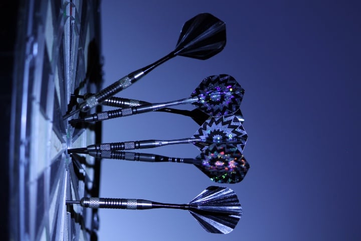 darts hitting dartboard
