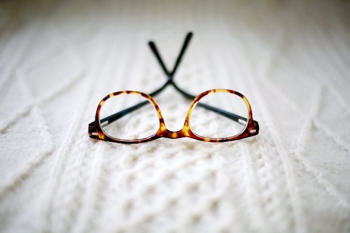 Reading glasses on a fabric