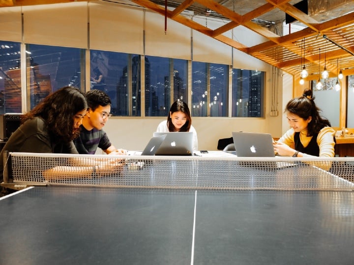 employees working at ping pong table