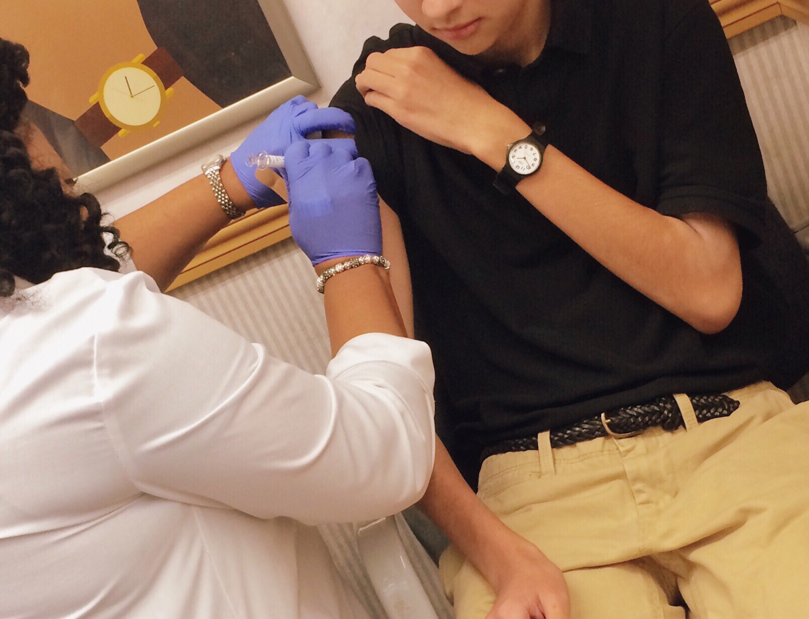 flu-shot-time-a-teen-is-getting-his-flu-shot-vaccine-which-it-s-offered-for-free-in-several-locations_t20_xvJNp1